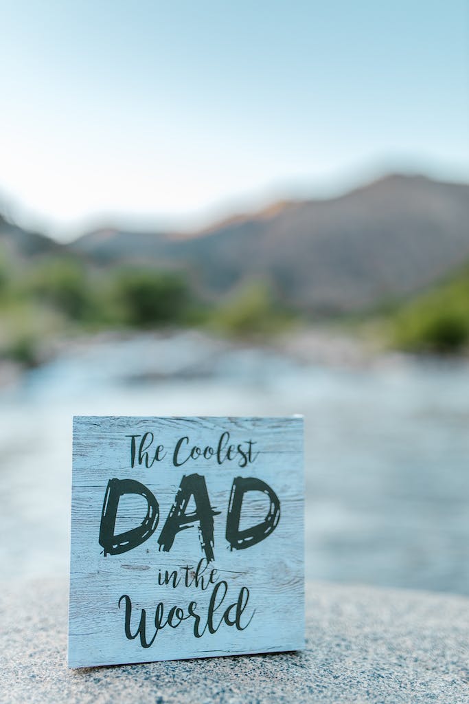 A Father's Day Gift Made of Wooden Board with the Coolest Dad in the World Sign